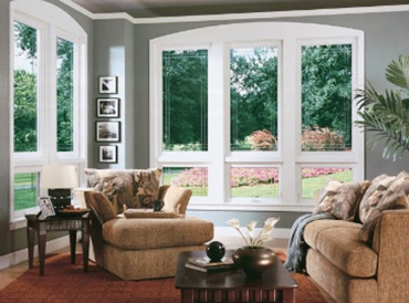 Large double pane windows in corner of living room